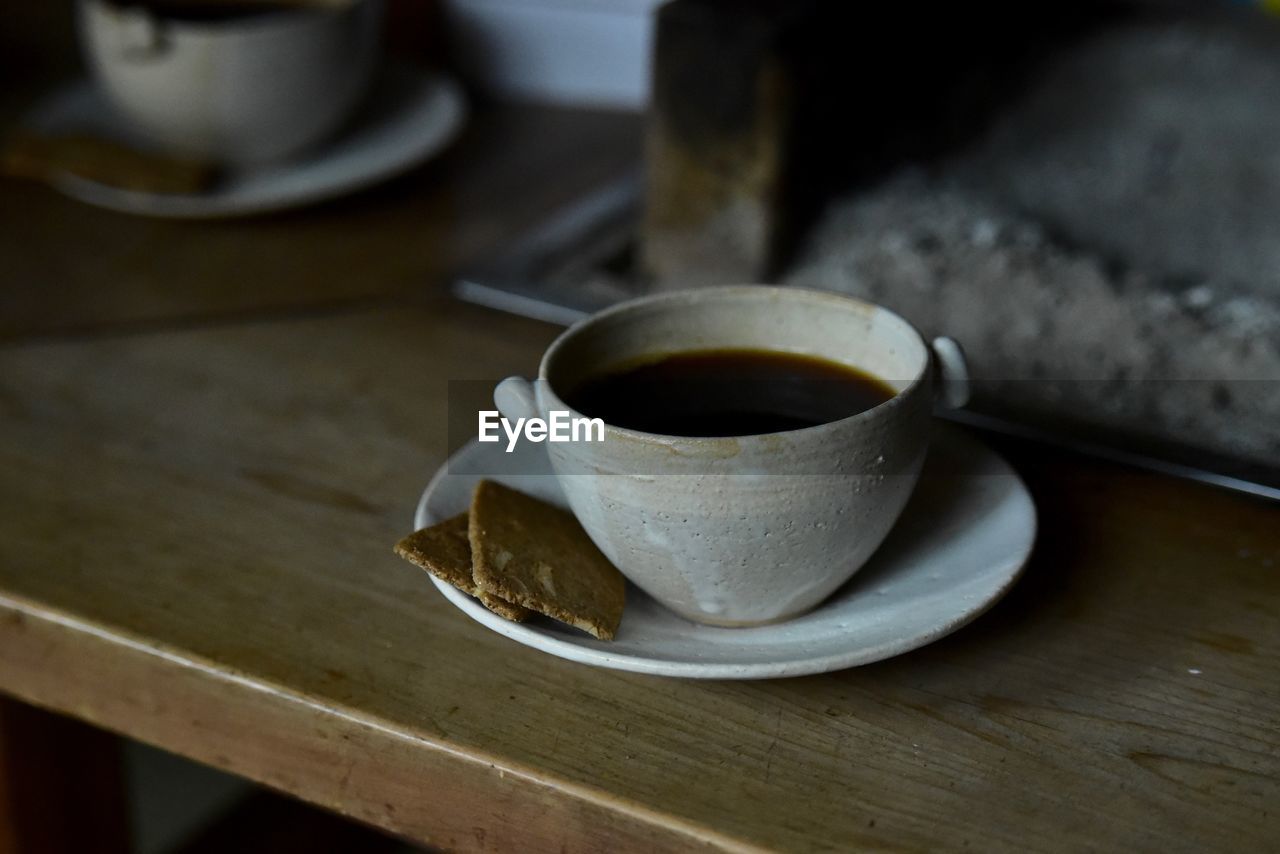 close-up of coffee cup on table