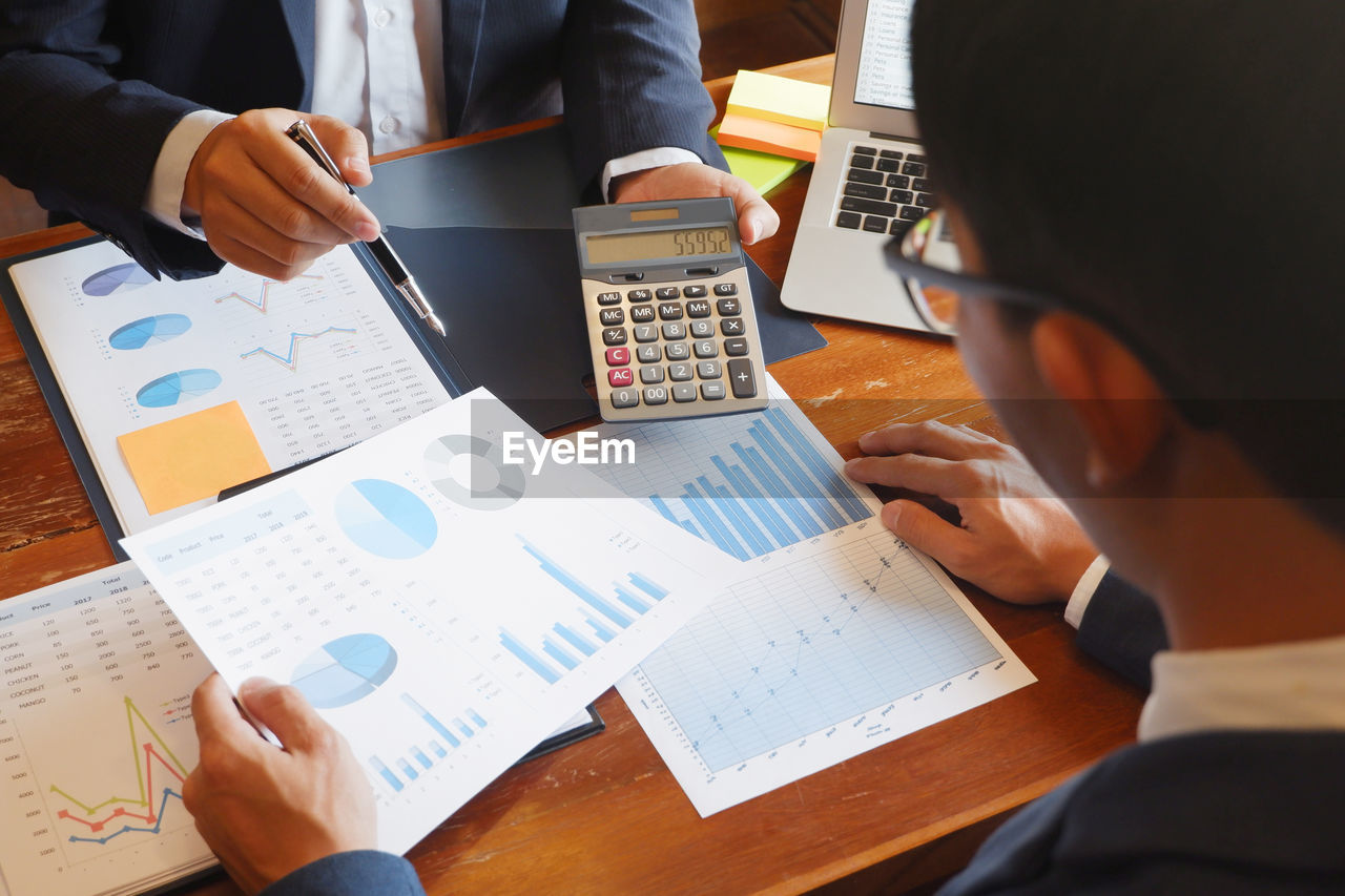 High angle view of business person having discussion in office