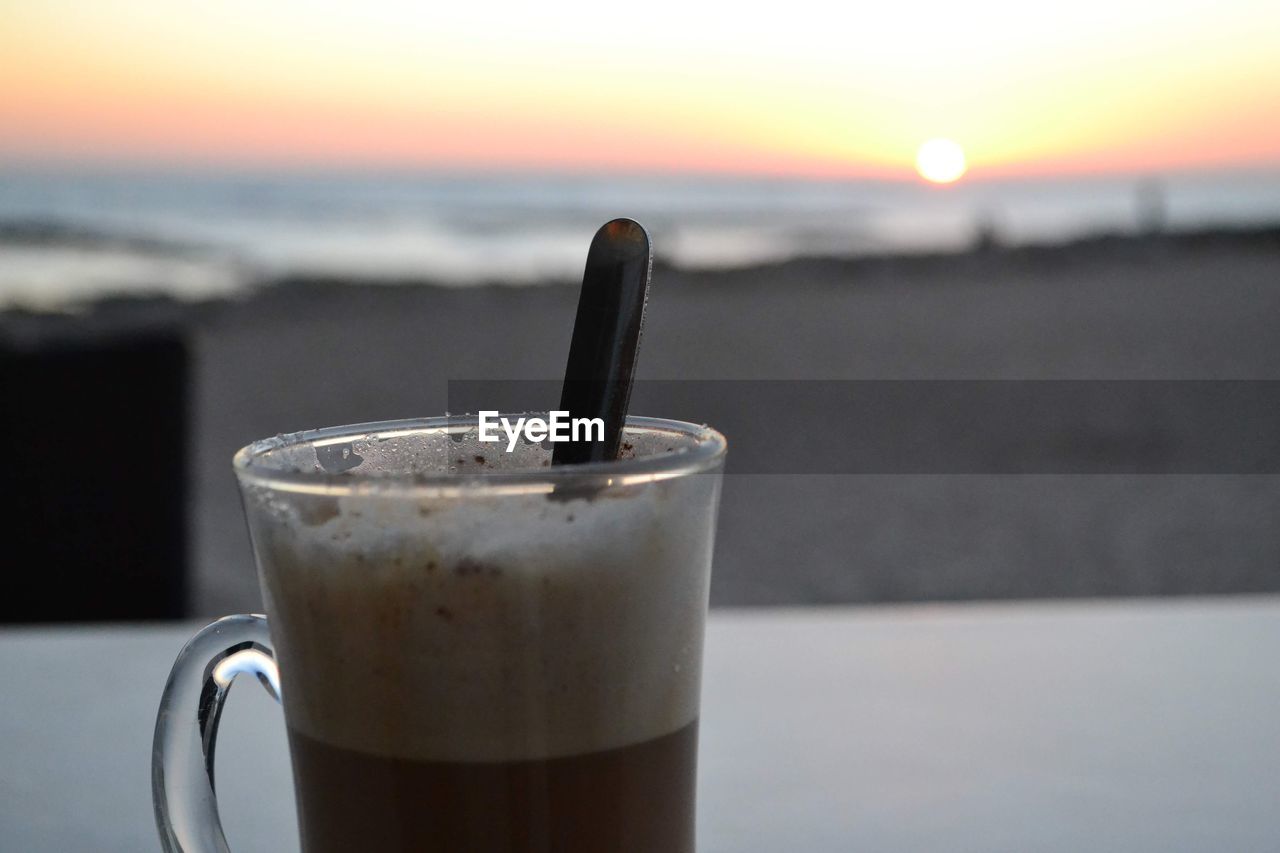 CLOSE-UP OF COFFEE ON TABLE