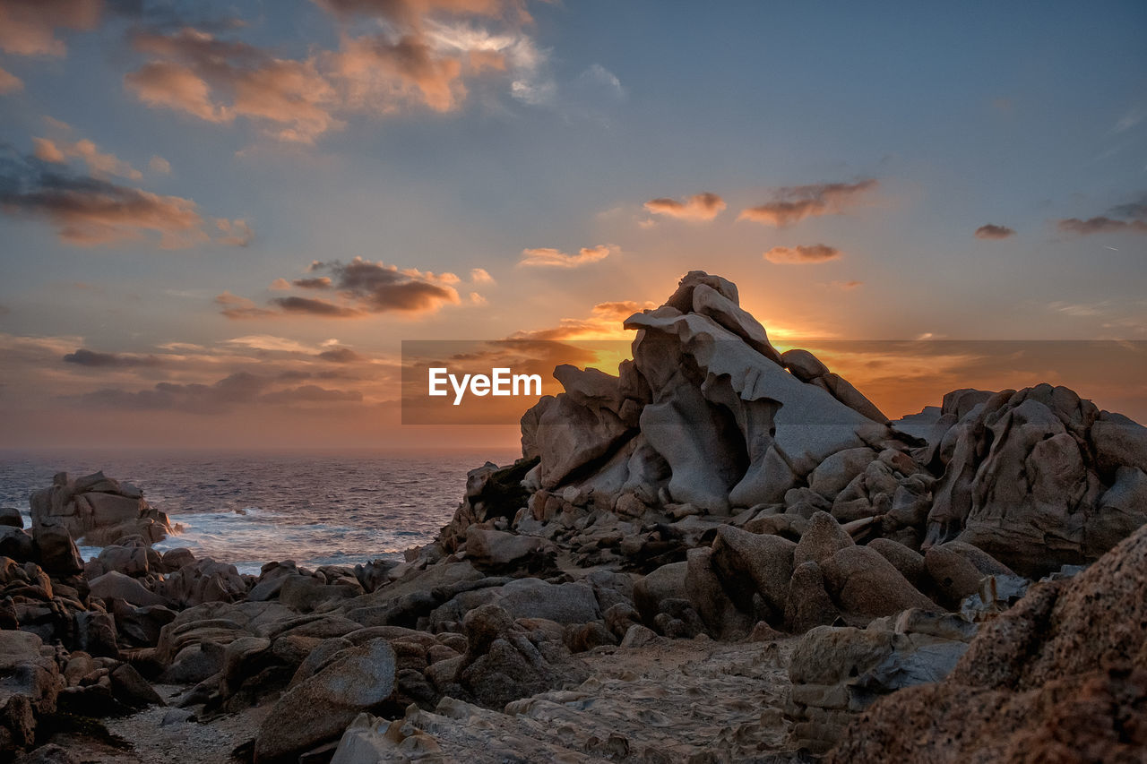 sky, rock, sunset, cloud, sea, nature, scenics - nature, land, beauty in nature, water, environment, landscape, beach, travel destinations, mountain, coast, travel, dawn, dramatic sky, horizon, tranquility, sun, no people, outdoors, rock formation, ocean, horizon over water, seascape, tranquil scene, sunlight