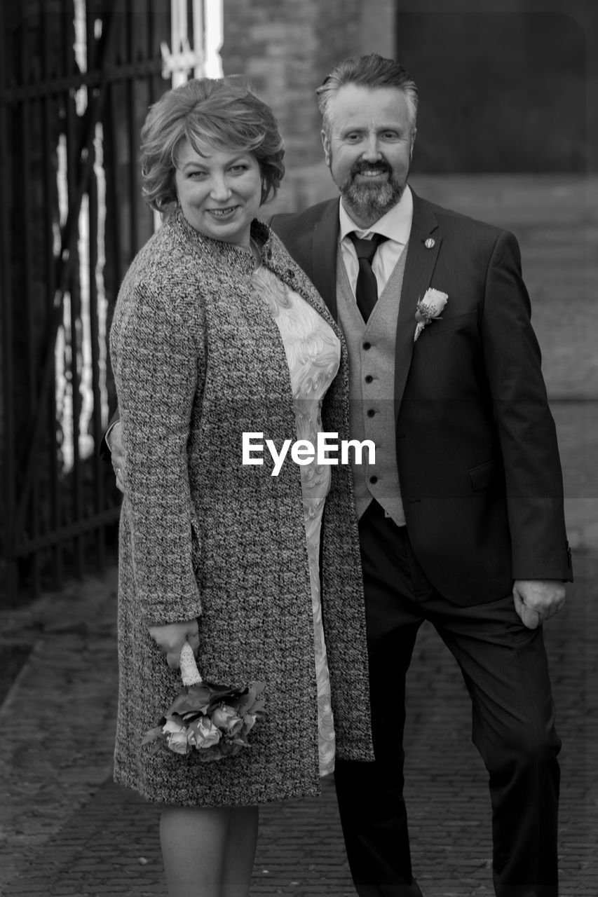 Portrait of couple standing outdoors