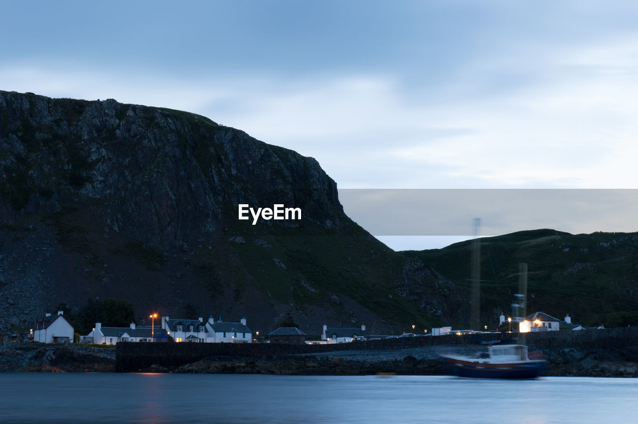 Scenic view of sea against sky at dusk