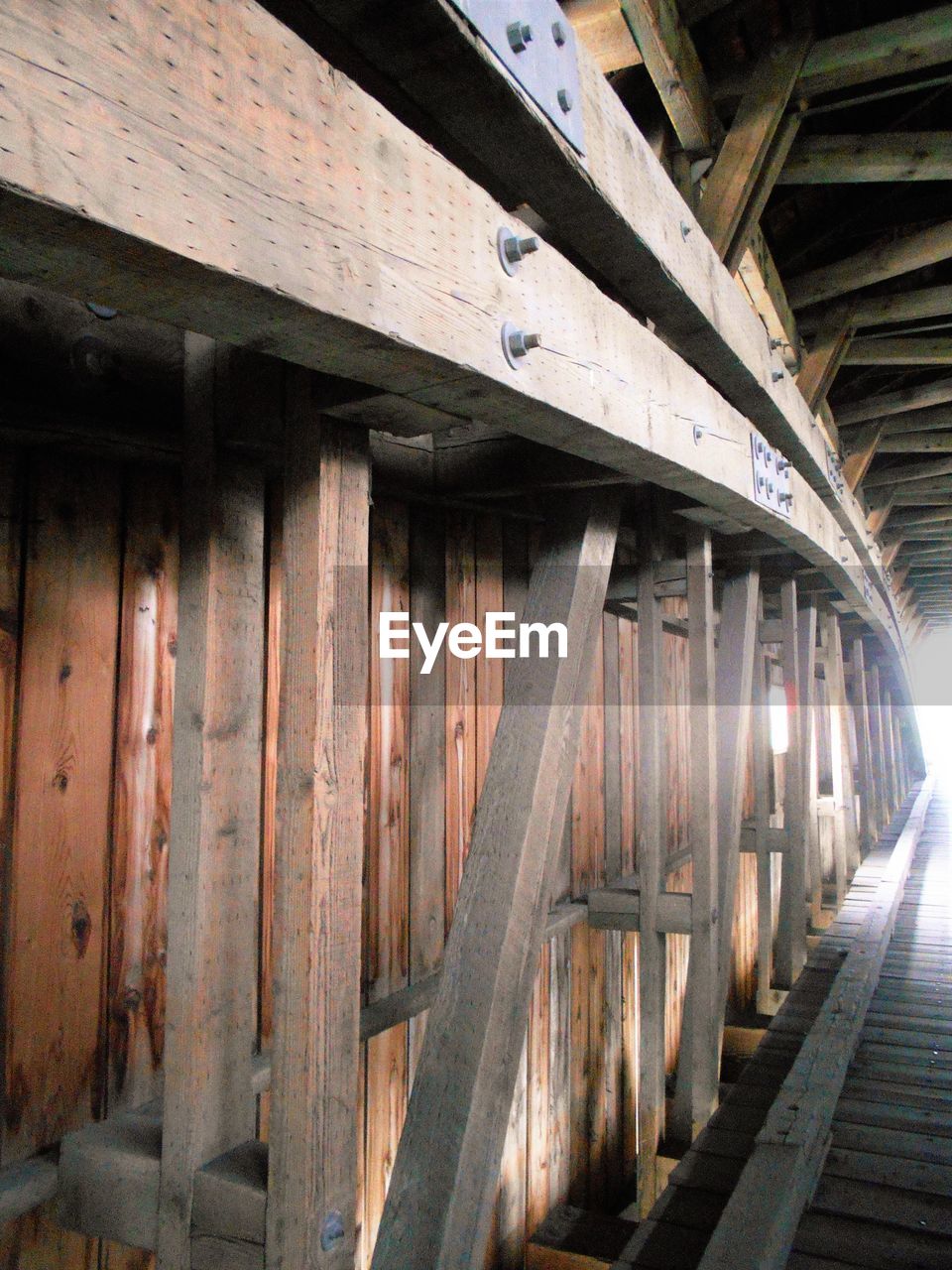 Wooden structure at covered bridge