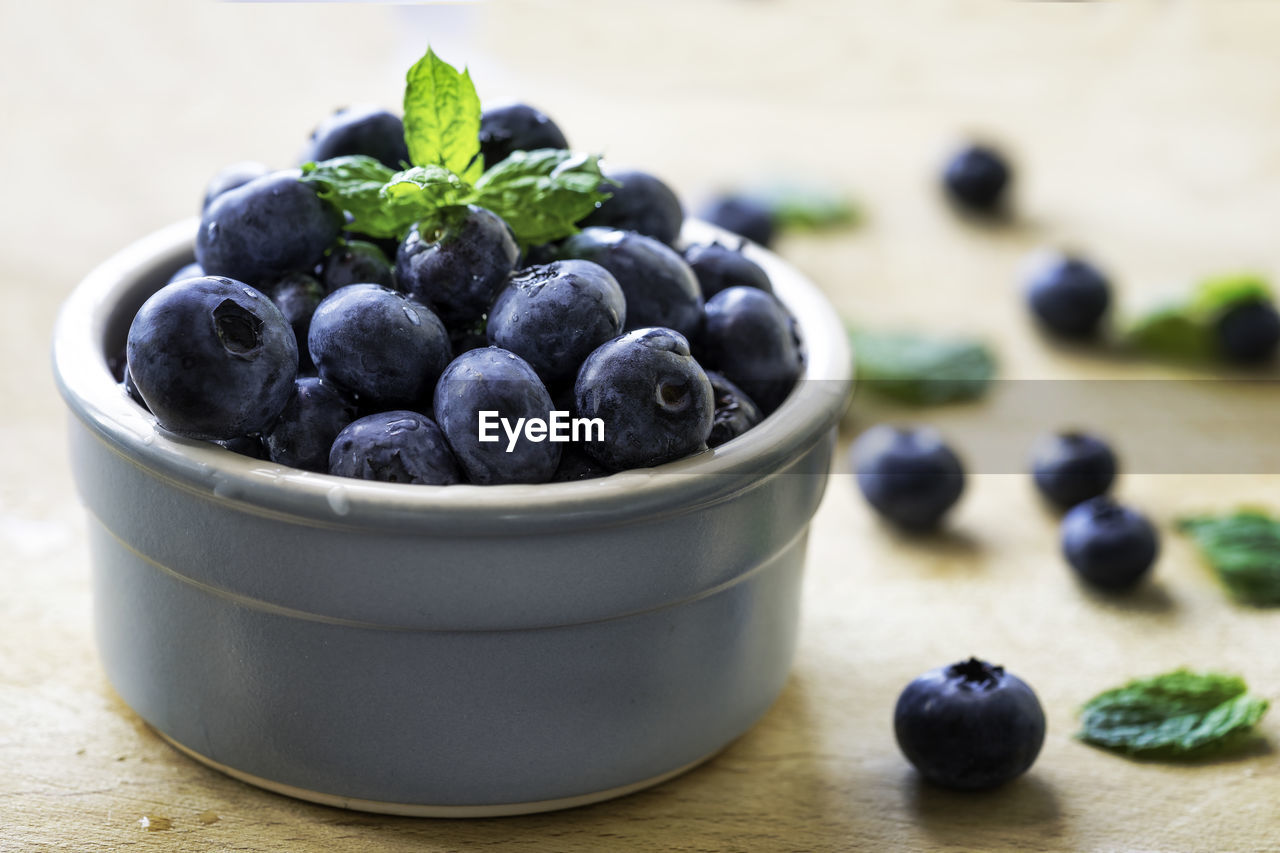 Close-up of fresh blueberries in bowl on table