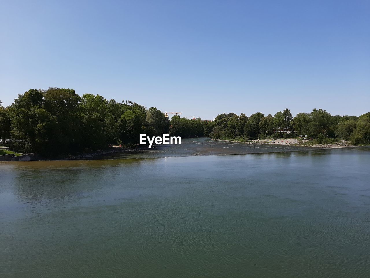 SCENIC VIEW OF LAKE BY TREES AGAINST CLEAR SKY