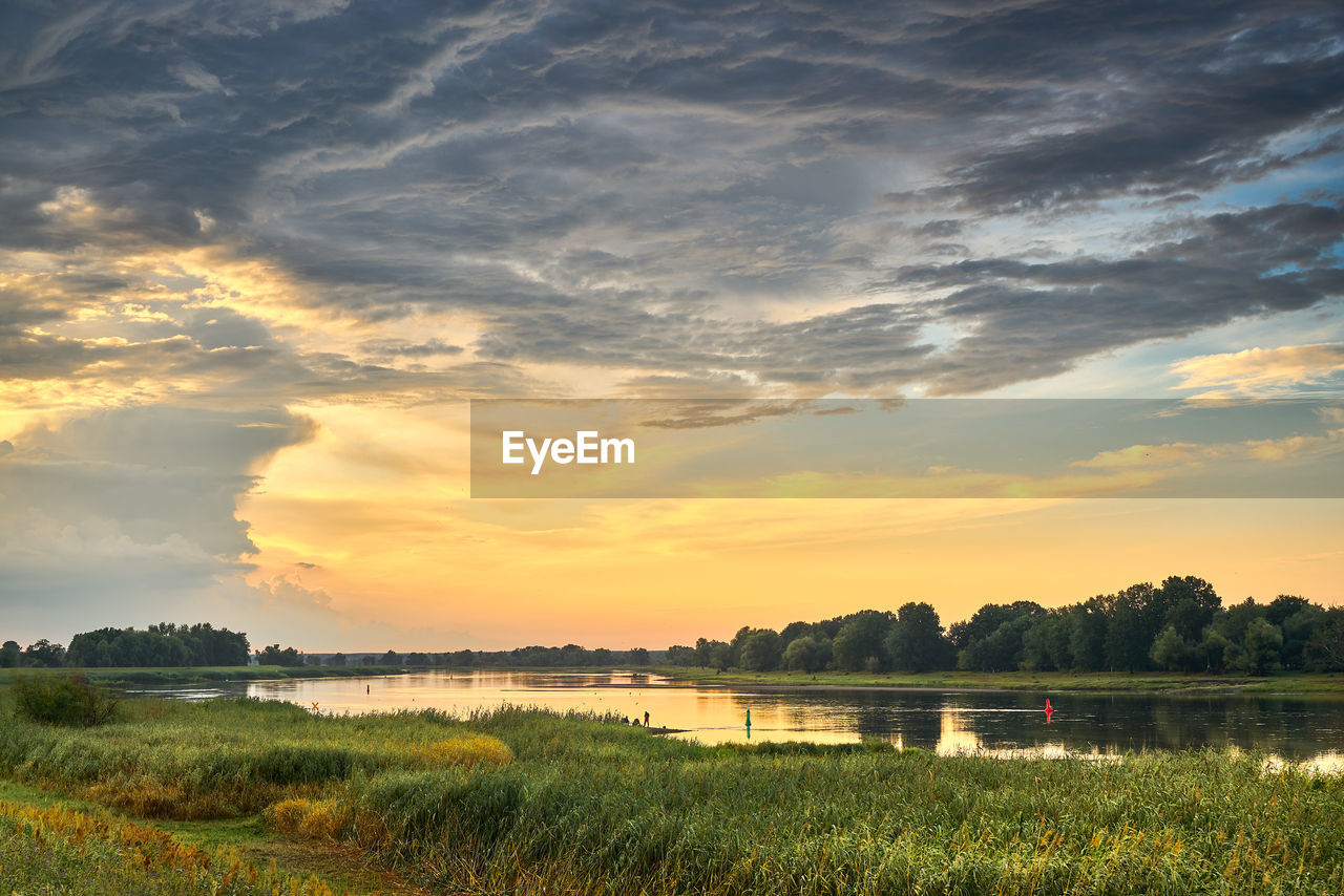 SCENIC VIEW OF LANDSCAPE AGAINST SKY DURING SUNSET