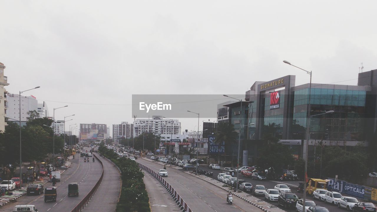 VIEW OF CITY STREET WITH BUILDINGS IN BACKGROUND