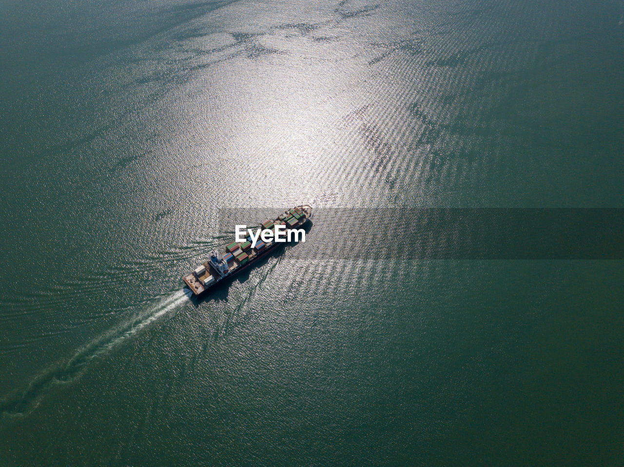 Aerial view of container ship in sea