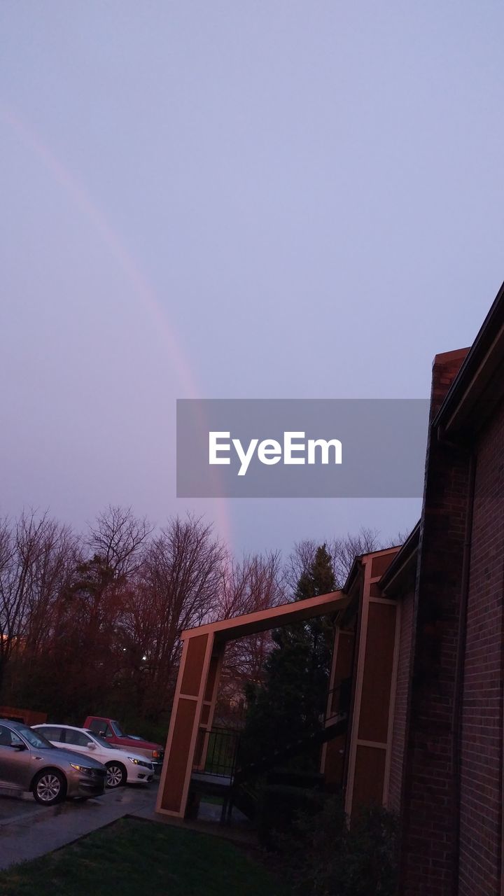 LOW ANGLE VIEW OF RAINBOW IN SKY