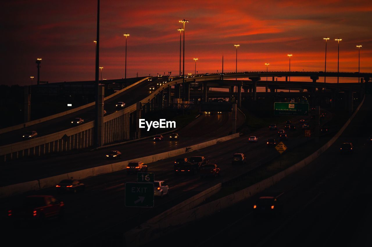 High angle view of vehicles on road at sunset