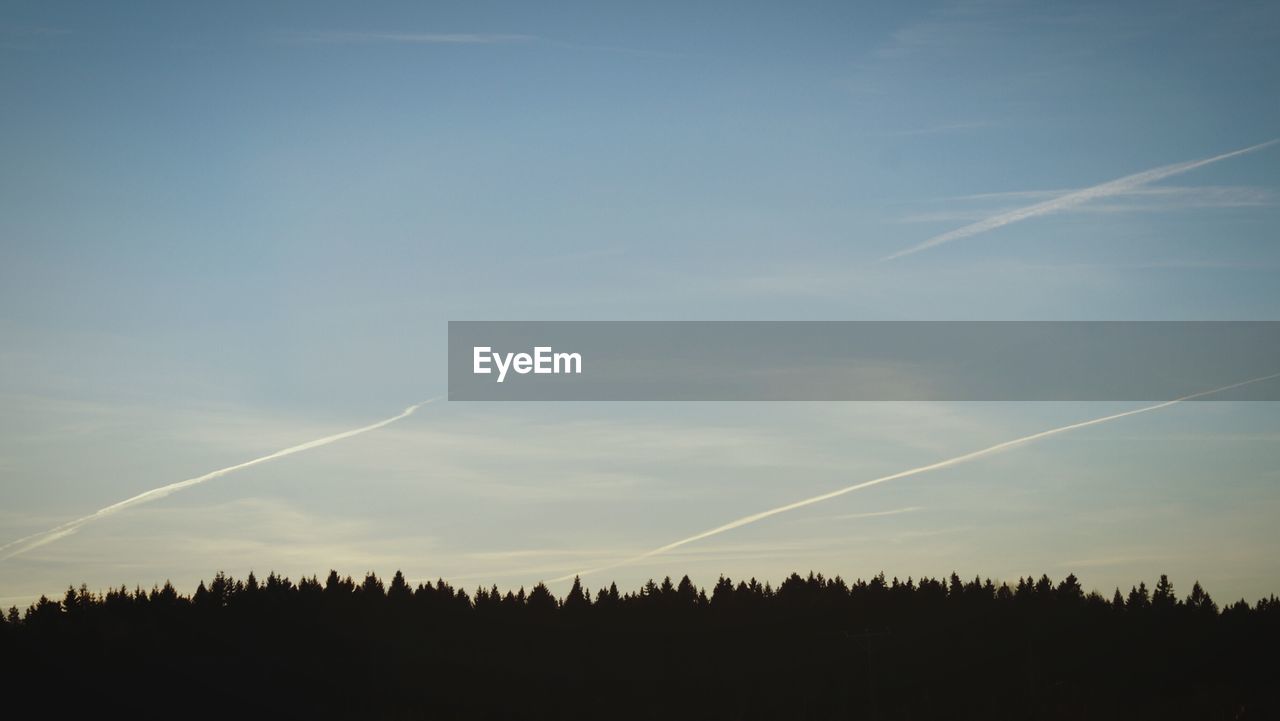 Panoramic view of vapor trails in sky