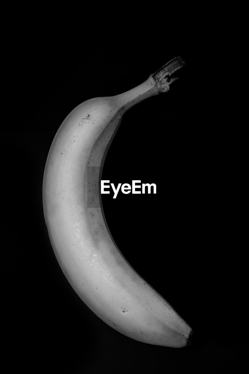 Close-up of banana on black background