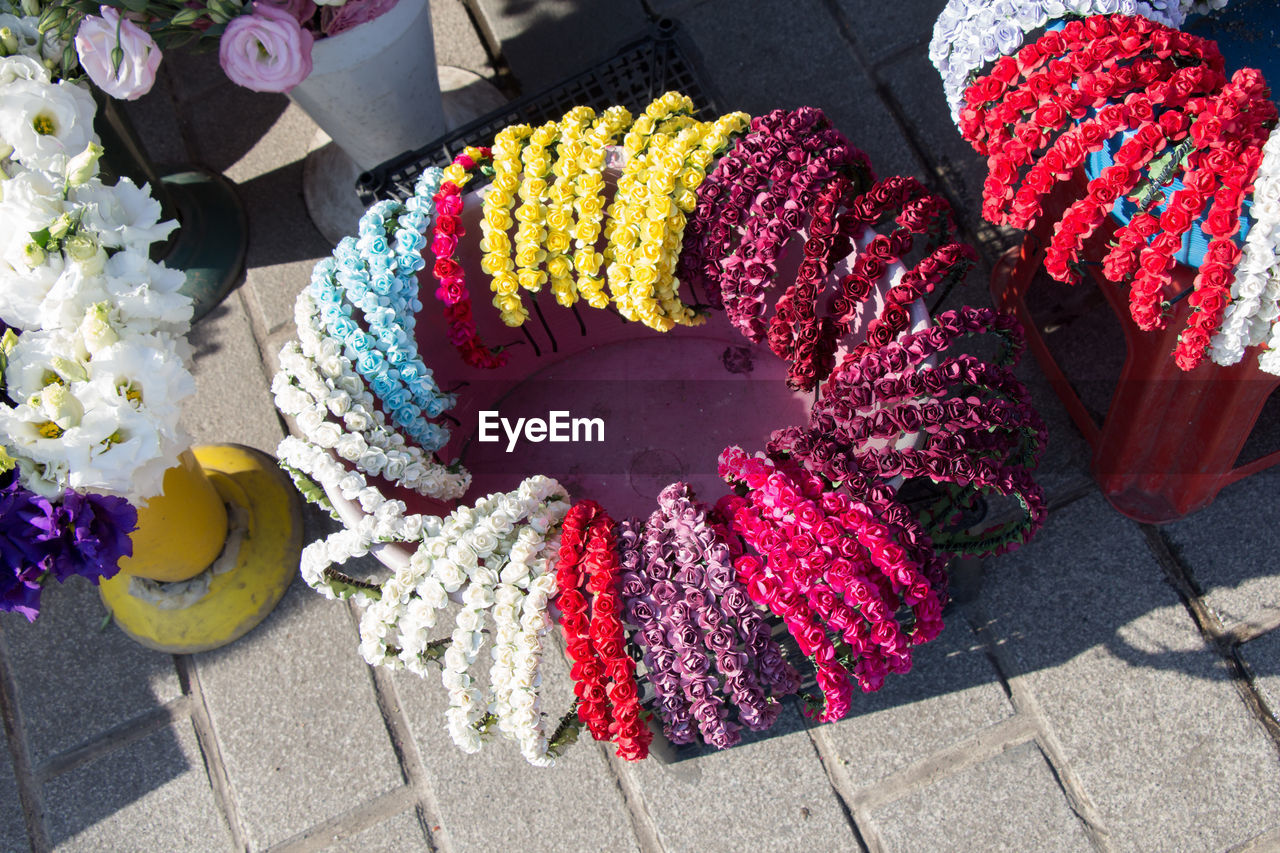 HIGH ANGLE VIEW OF MULTI COLORED FLOWERS IN MARKET