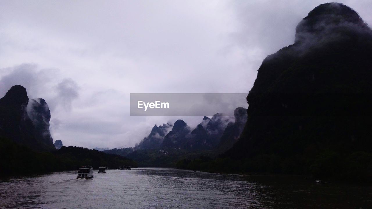 PANORAMIC SHOT OF ROCKS AGAINST SKY