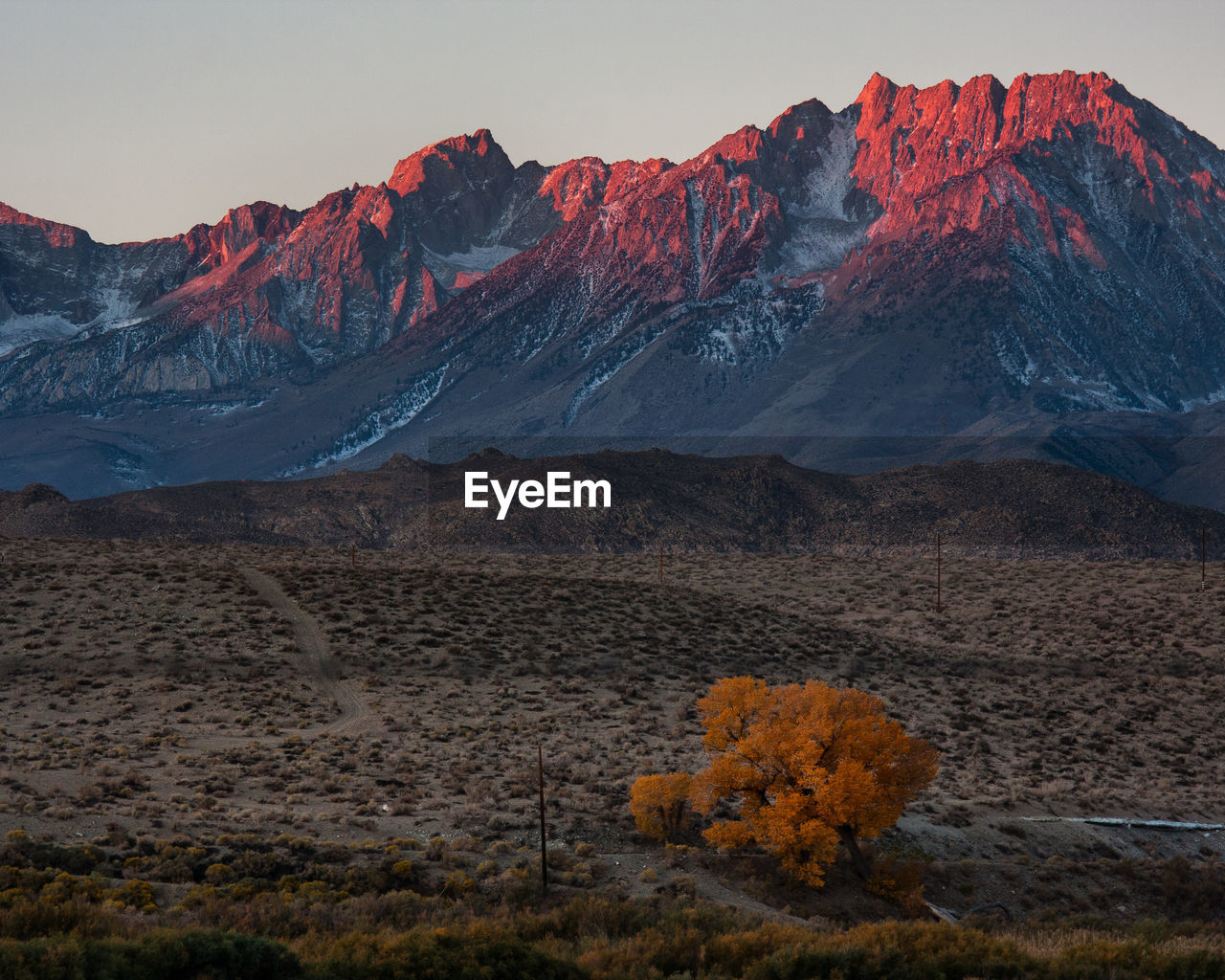 Scenic view of rocky mountain range at sunset