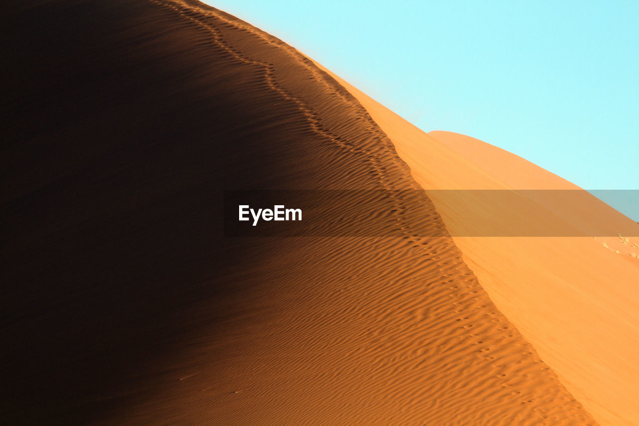 Scenic view of desert against clear sky