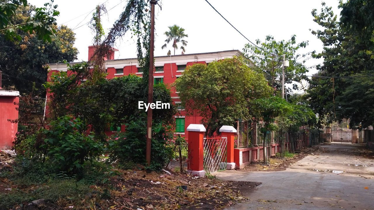 RED STRUCTURE AGAINST TREES