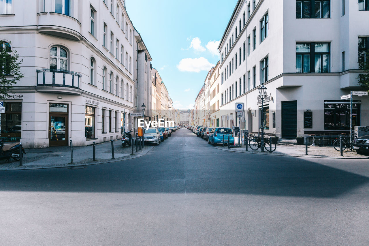 City street amidst buildings against sky