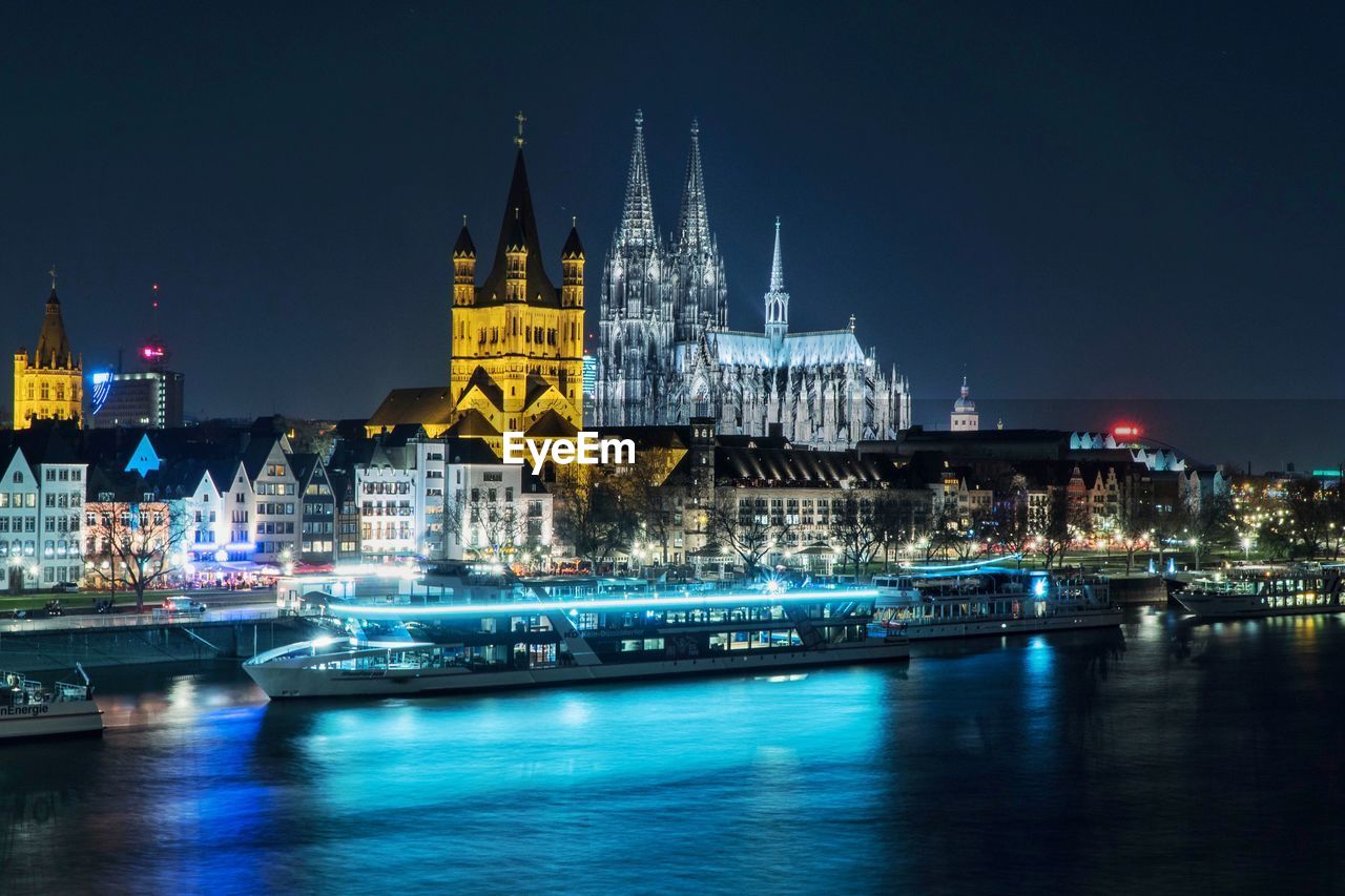 View of illuminated buildings at waterfront