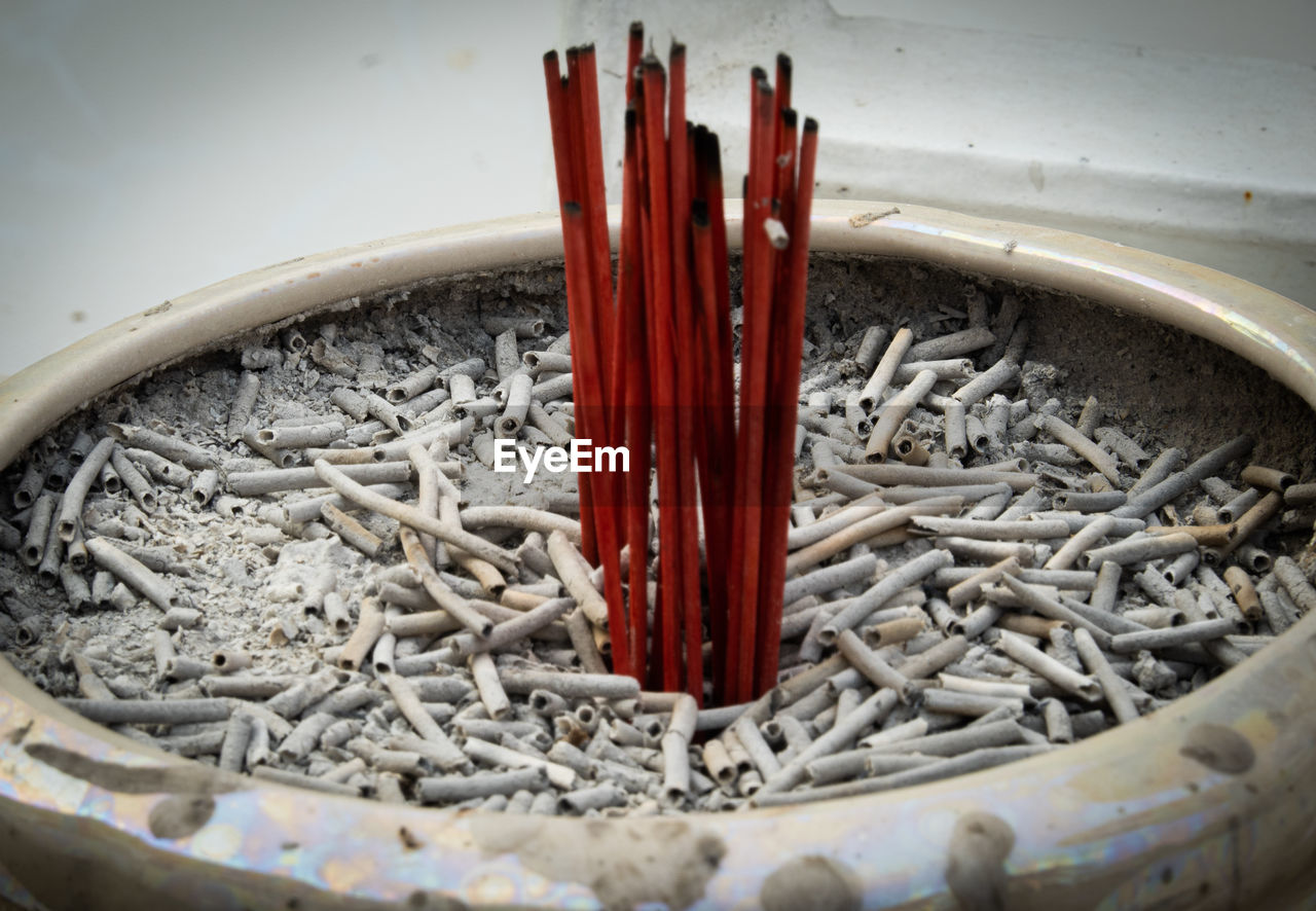 Close-up of the incense stick in the censer