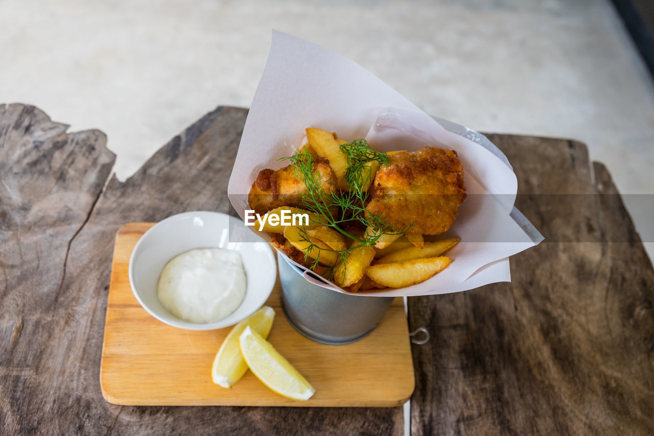 Fried chicken wings on wooden table. breaded crispy fried kentucky chicken tasty dinner