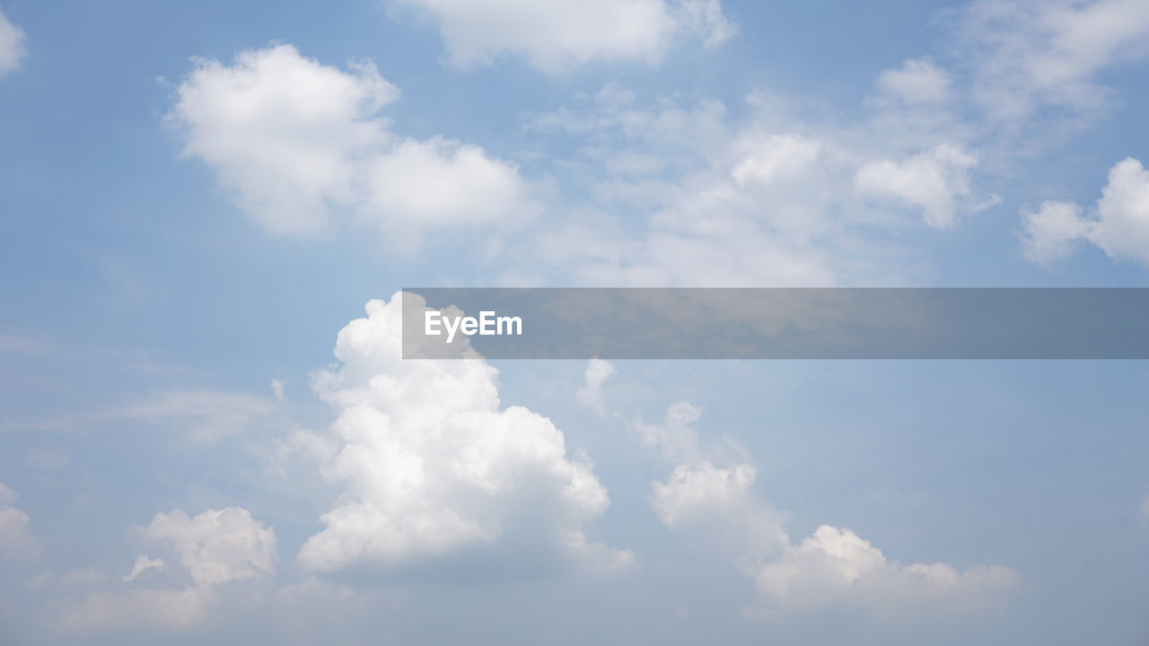 LOW ANGLE VIEW OF CLOUDS IN BLUE SKY