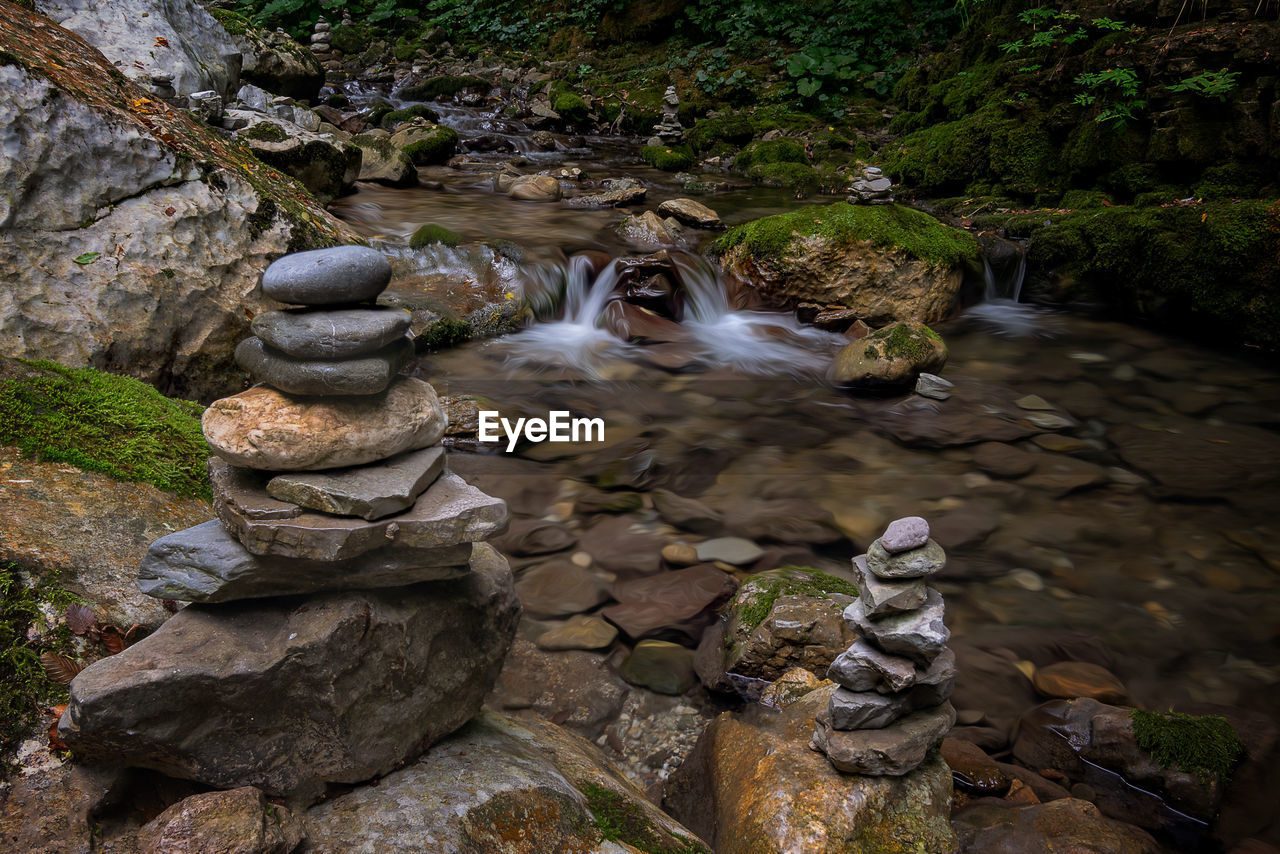 VIEW OF WATERFALL IN ROCKS