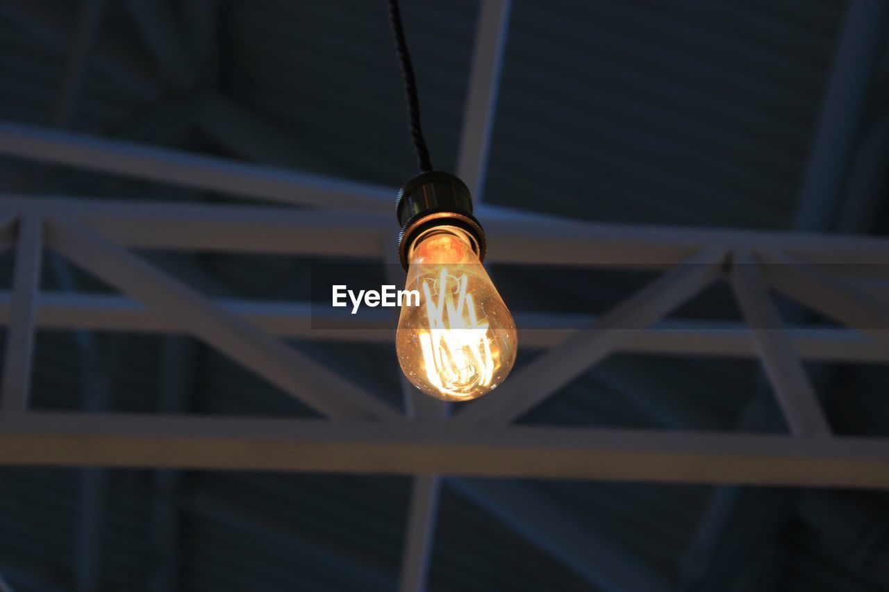 Low angle view of illuminated light bulb