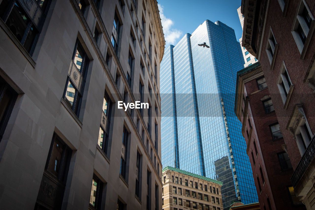 Low angle view of buildings against sky in city