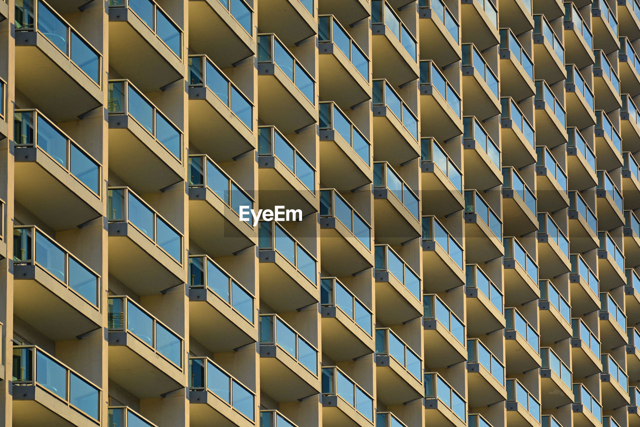 Full frame shot of apartment condo building  balconies pattern