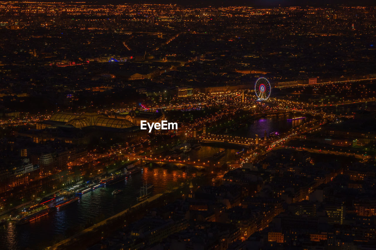 High angle view of illuminated cityscape seen from eiffel tower