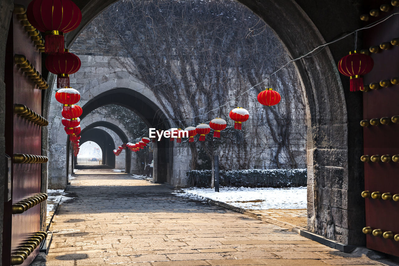 RED LANTERN HANGING ON WALL