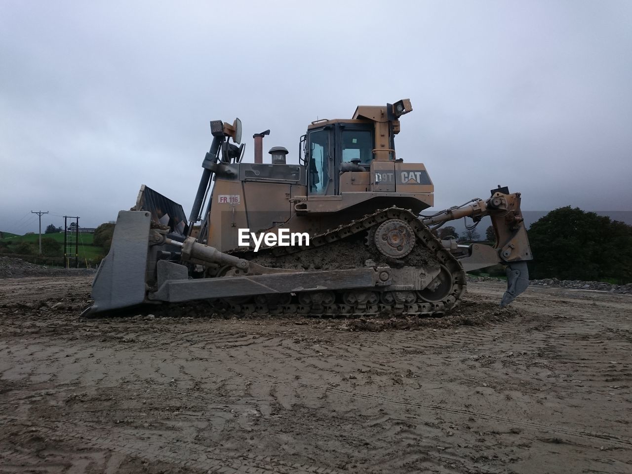 MAN WORKING AT CONSTRUCTION SITE