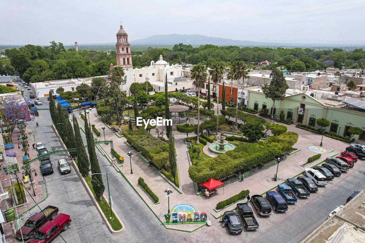 high angle view of buildings in city against sky