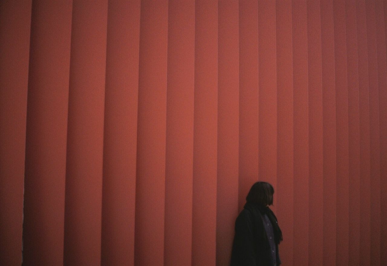 REAR VIEW OF A PERSON WITH UMBRELLA