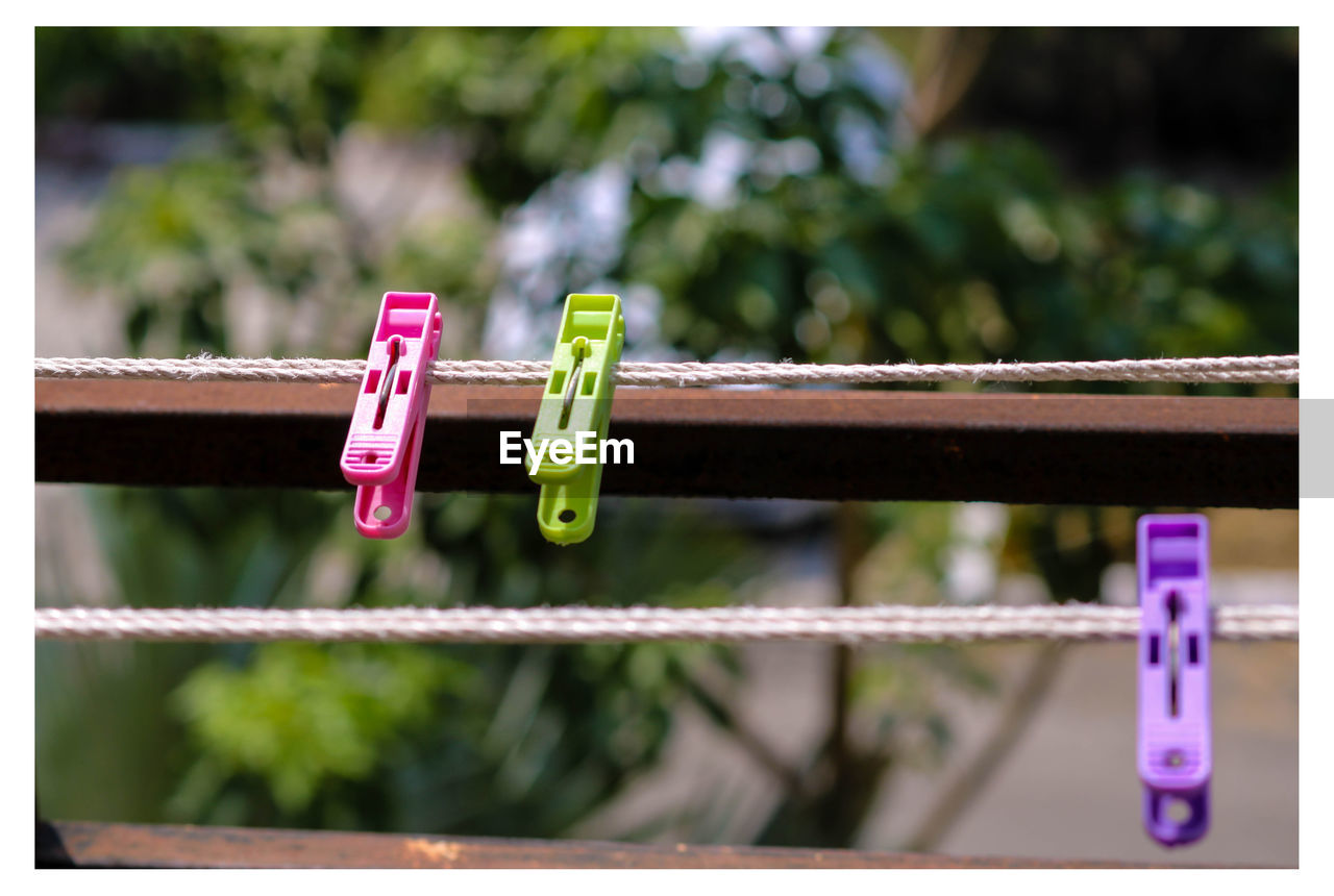 Multi colored clothespins on rope