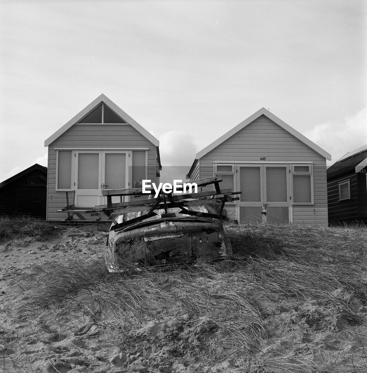 Houses on field against sky