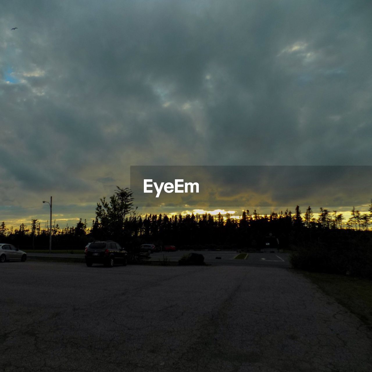 ROAD PASSING THROUGH DRAMATIC SKY