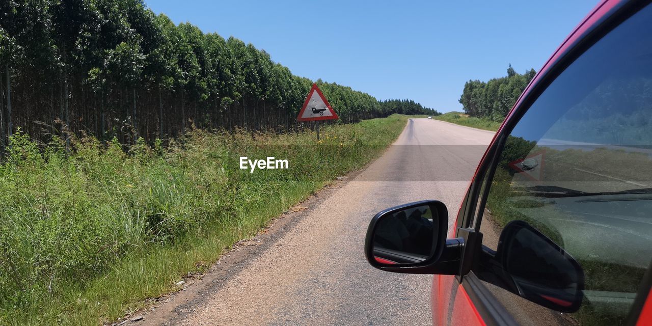 VIEW OF CAR ON ROAD