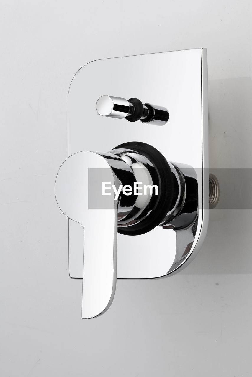 CLOSE-UP OF TELEPHONE BOOTH AGAINST WHITE BACKGROUND