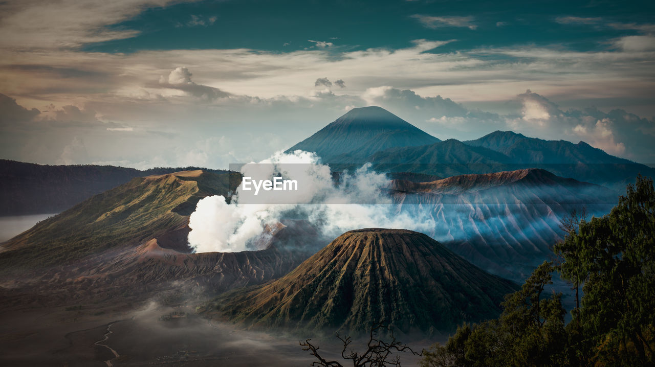 Smoke emitting from volcanic mountain