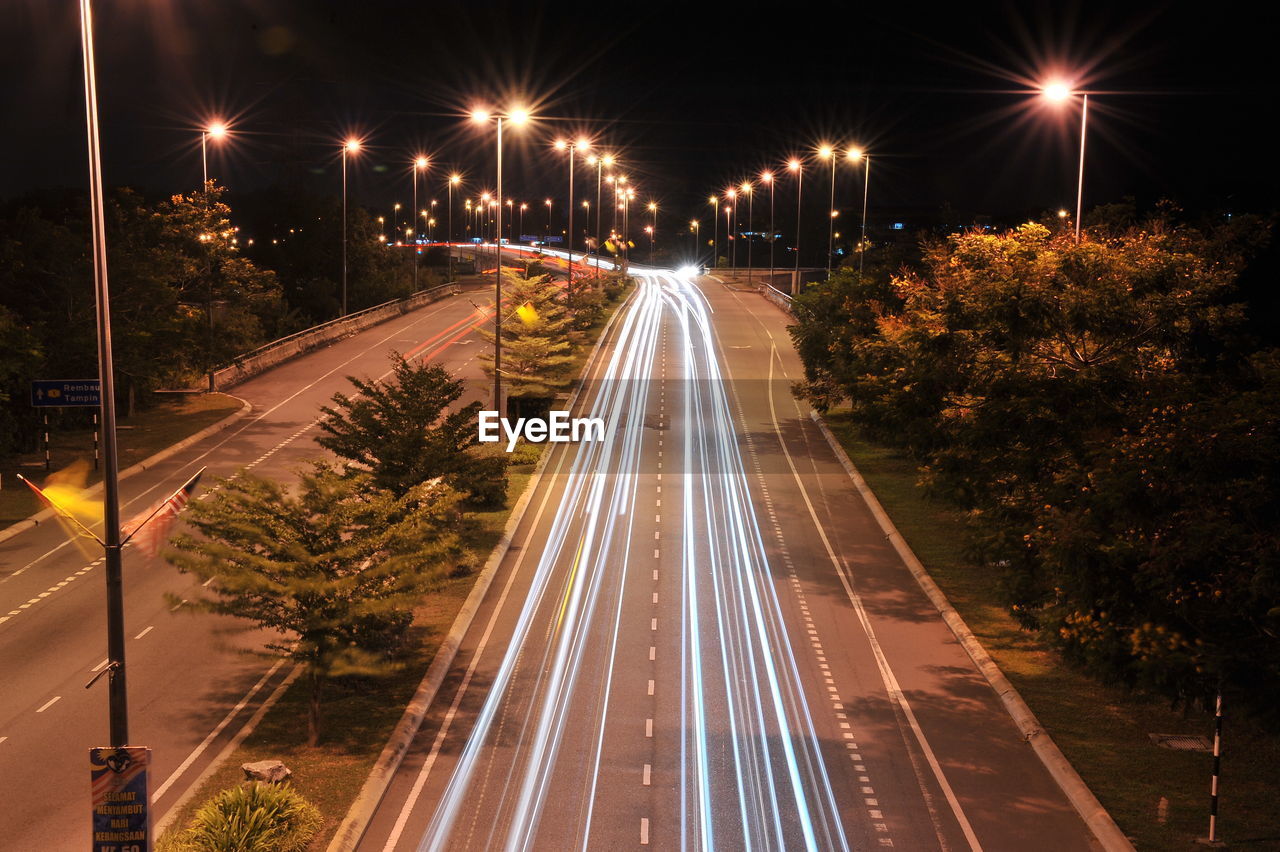 High angle view of light trails on road