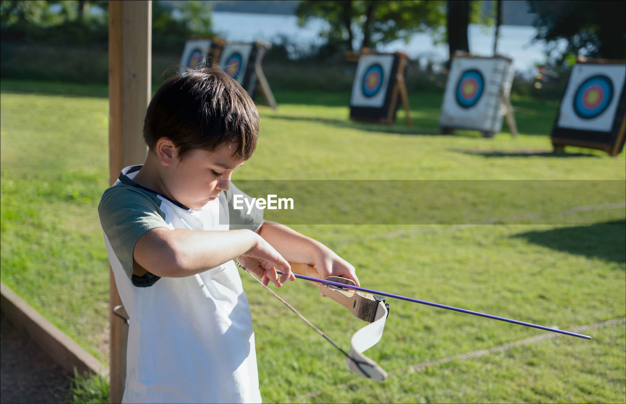 Boy holding bow and arrow