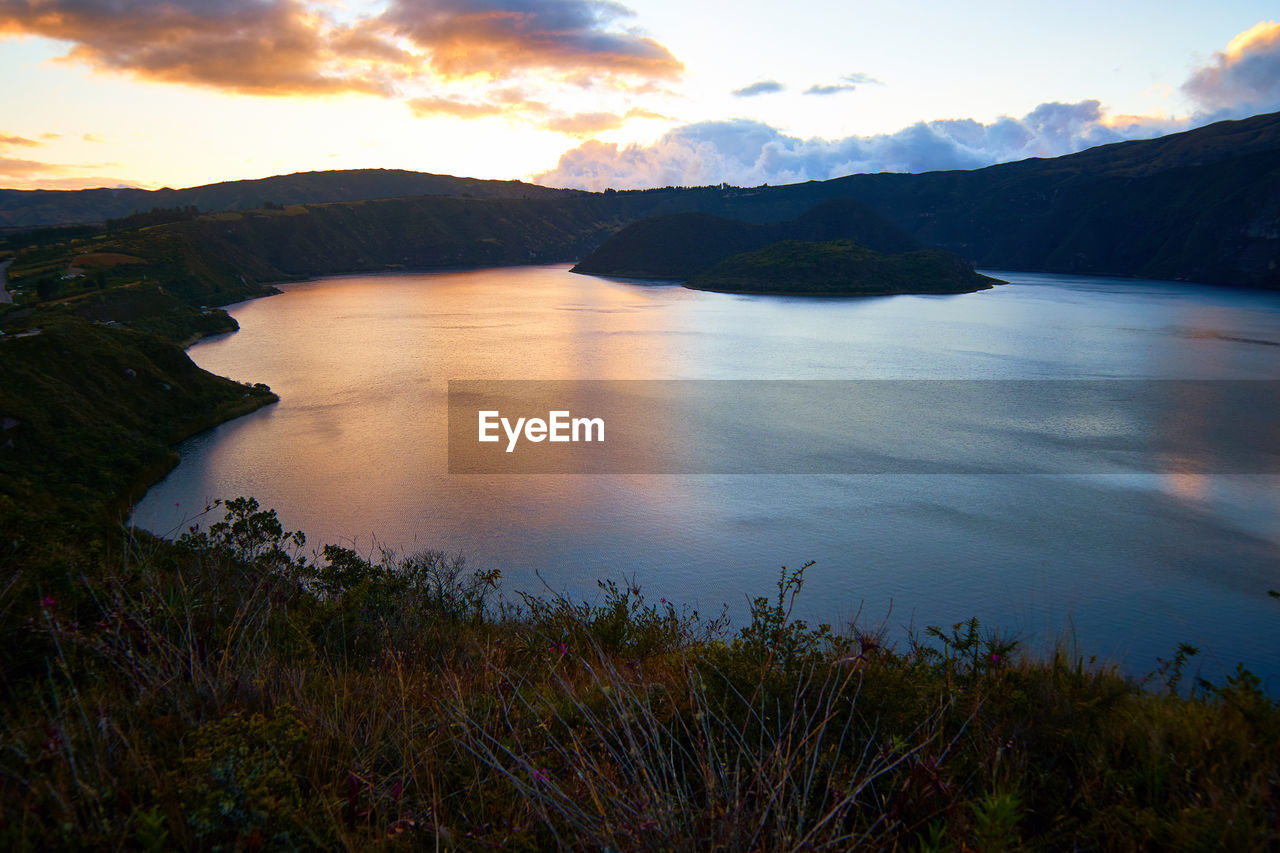 Scenic view of lake against sky during sunset