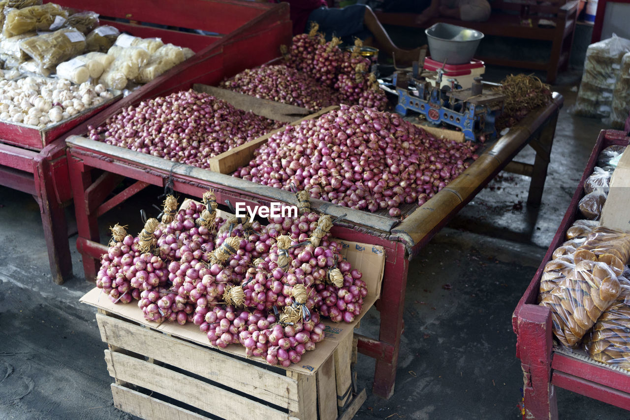 Shallots sold at street vendor in glagah beach in kulonprogo, indonesia. street photography.