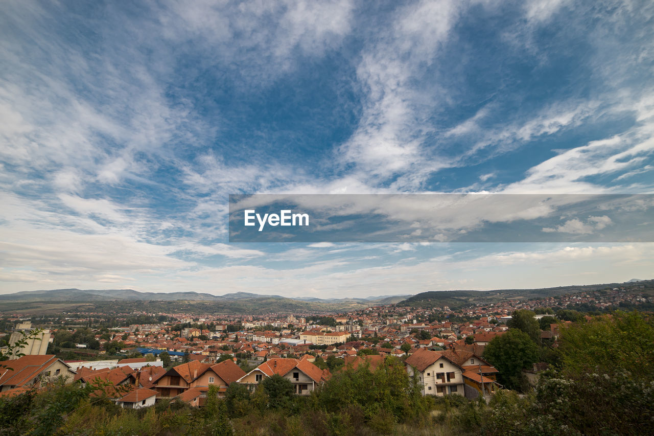 Aerial view of townscape against sky