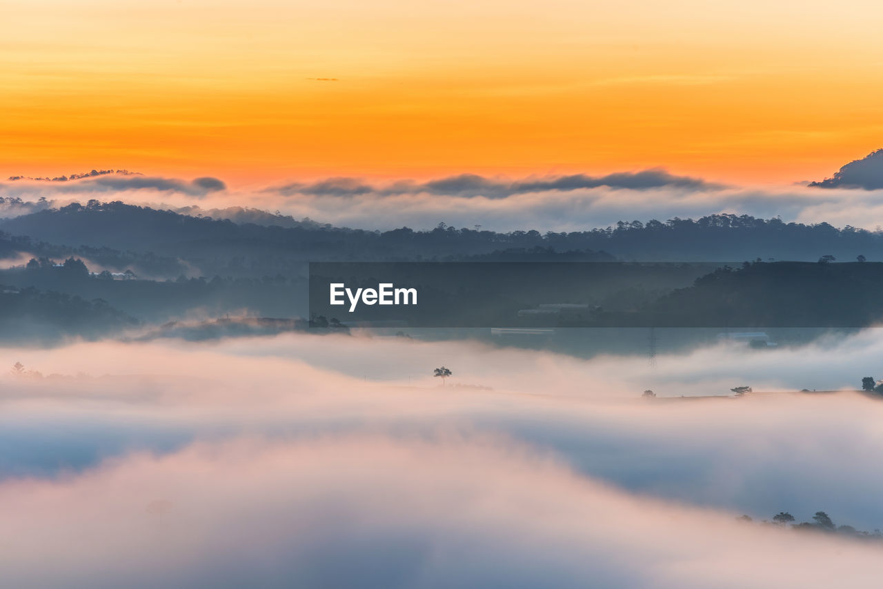 SCENIC VIEW OF DRAMATIC SKY OVER SILHOUETTE DURING SUNSET