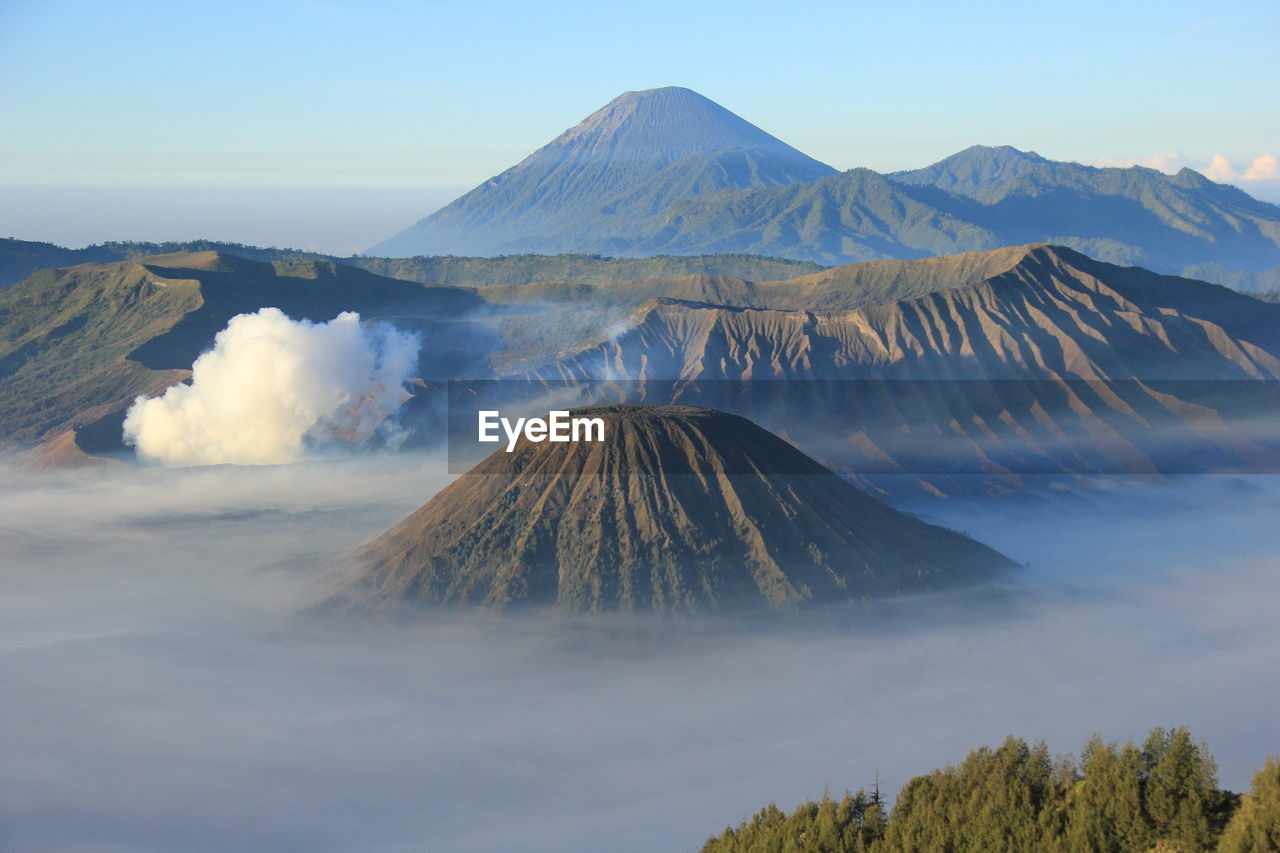 High angle view of volcanic mountains against sky