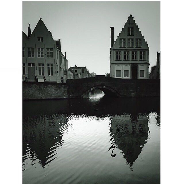 RIVER WITH BUILDINGS IN BACKGROUND