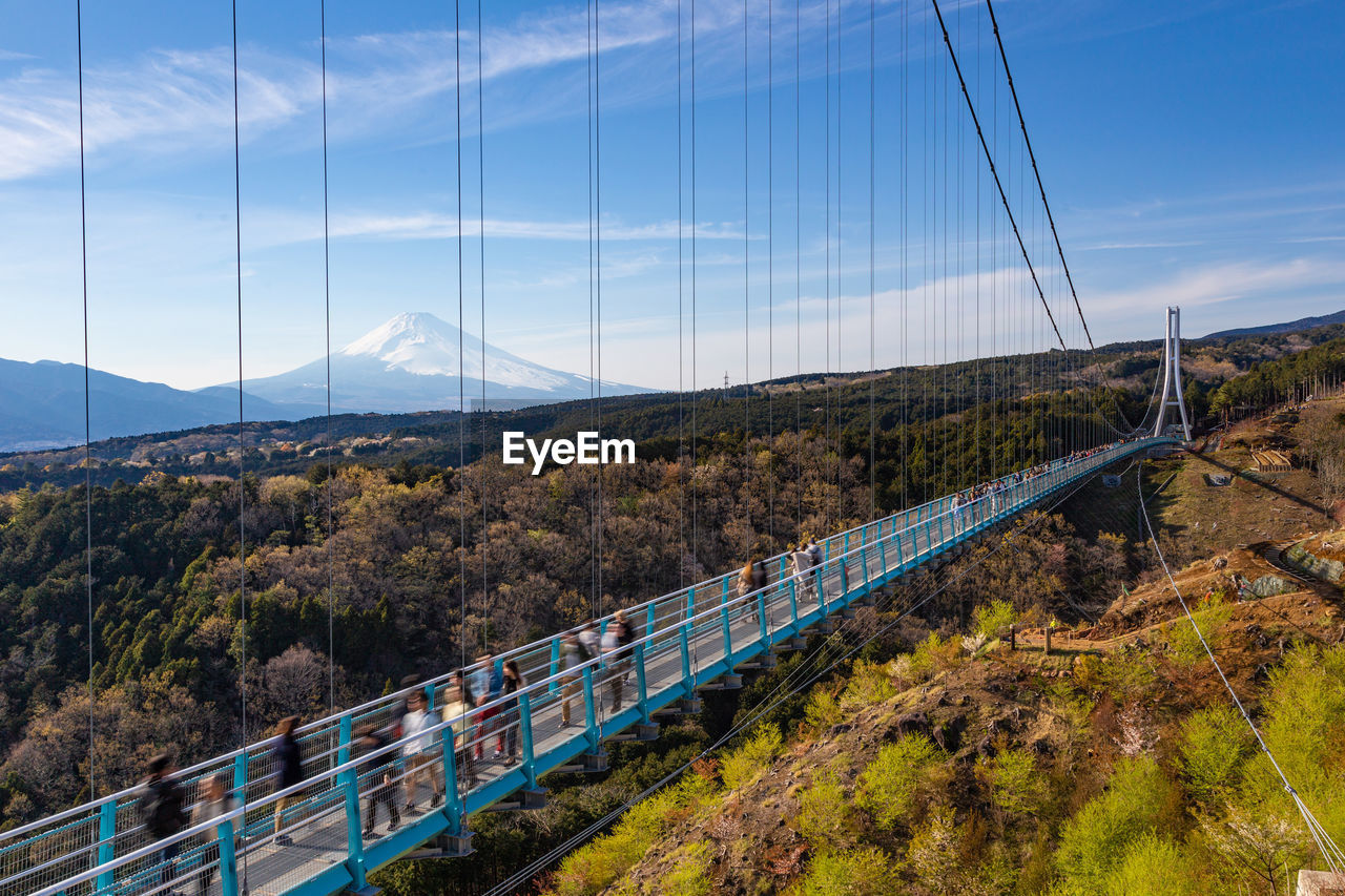 Bridge over road against sky